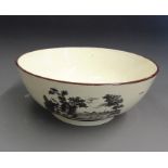 A large creamware bowl, printed with three rural scenes with initials on the inside centre, circa