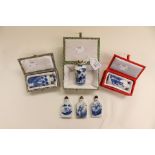 Six Chinese porcelain snuff bottles each with different blue and white scenes, three boxed, five