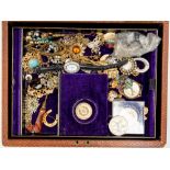 A collection of costume jewellery in a box