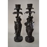 A pair of Musketeers cast iron candlesticks