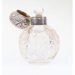 An early Edwardian silver topped hob nail cut glass perfume bottle and stopper with hinged cover,
