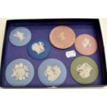 A collection of seven 20th Century Wedgwood Jasper ware roundels all with classical figures, one