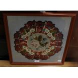 An Edwardian wool and breadwork panel, framed