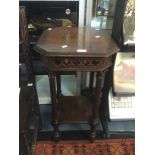 An ecclesiastic small occasional table with turned column legs in oak