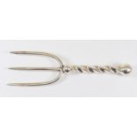 A white metal three prong meat or bread  fork with barley twist handle