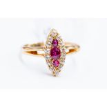 A Victorian style ruby and diamond cluster ring, marquise shaped head set with an three rubies