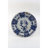 A Delftware blue and white dish, probably Bristol, circa 1740, painted in Chinese style with a