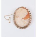 A cameo brooch with fancy decorative 9ct gold border, size approx 55mm x 45mm, total gross weight