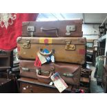 Three vintage suitcases, one with; "Cunard Line First Class" label on