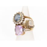 Three 9ct gold rings including an amethyst version, size O, along with a synthetic sapphire set