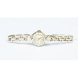 A vintage Omega 9ct white gold wristwatch, round dial, bracelet link strap, total gross weight