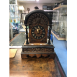 A late 19th Century cuckoo bracket clock, of Gothic design, height 50cm, width 38cm