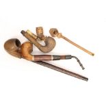 Collection of pipe smoking paraphernalia 19th and 20th Century