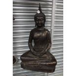 A decorative gilt metal figure of a seated buddha
