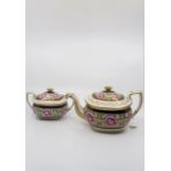 An early 19th century teapot and cover and matching sucrier and cover, painted with flowers and