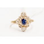 A  sapphire and diamond cluster, comprising an oval sapphire with a old cut and rose cut border,