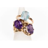 Three 9ct gold rings, comprising two fancy claw set amethyst dress rings both with faceted oval