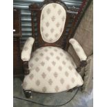 Mahogany and cream upholstered late Victorian parlour chair on castors