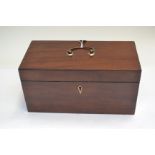 A George III mahogany tea caddy, cover swing handle, triple division interior,