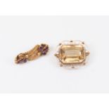 A citrine and unmarked yellow metal brooch, (assessed as 9ct gold ) the emerald cut citrine