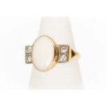An opal and diamond ring, the oval opal 14mm x 10mm, rub-over set in 18ct gold, with double set