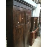 Late 19th Century to early 20th Century oak wardrobe with internal drawers and slide trays