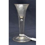 An 18th century wine glass, the trumpet bowl on tear drop stem and conical foot, 13cm high, 5.3cm
