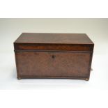 A George III amboyna tea caddy, crossbanded and string, triple division interior, brass side