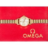A ladies Omega watch, 9ct gold case,champagne dial, case diameter approx 16mm, on later plated