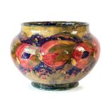A large W Moorcroft pomegranate jardinere, green, with W Moorcroft signature. Height 25cm Condition:
