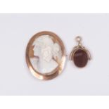 A 9ct gold mounted cameo brooch, approx 11 grams gross; and a 9ct swivel fob set carnelian and