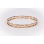 A 9ct gold slave bangle with Greek key design, internal diameter approx 70mm,  pattern design weight