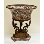 A highly decorated Imari pattern jardiniere on a stand with base metal detail