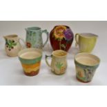 Beswick jugs and vases, including Chrysanthemum vase in red 1605, green jug 874-2, yellow floral jug