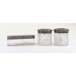 Two dressing table jars and covers, hobnail cutting, Birmingham 1922 and a 1919 silver capped pin/