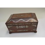 A Regency rosewood work casket of sarcophagus form, mother of pearl inlay, fitted interior, bun