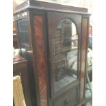 An early 20th century oak and inlay burr walnut display cabinet on cabriole supports.