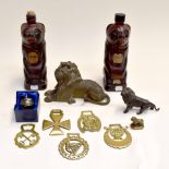 Oriental bronze statue lion plus brasses and two glass vodka bottles in the form of bears, plus
