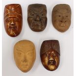 A Collection of five various Japanese carved netsuke depicting masks 2x Ivory and 3x Bizen clay