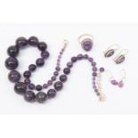 An amethyst graduated round bead necklace, along with a cabachon silver mounted ring, size P,