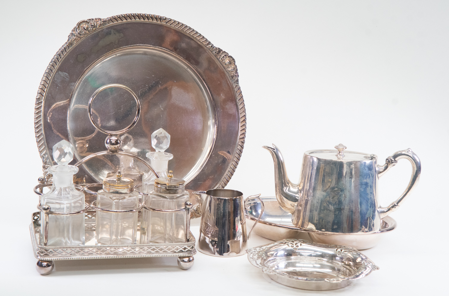 Group of silver plated items including a stand with four glass bottles, Walker & Hall entree dish,