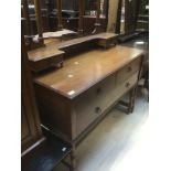 A 20th Century dressing table having two small over one large drawer, with metal galleried
