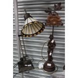 Two reproduction Tiffany table lamps, one desk and one figure of a lady