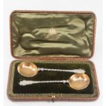 A pair of cased Georgian Scottish silver ladles, gilt bowl to silver barley twist stems, marks for