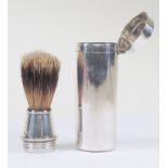 A silver travelling shaving brush in silver tube case, 1923, London marks