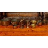 Kitchenalia interest, Quantity of graduated copper and brass saucepans and pots and a coal