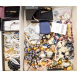 A collection of costume jewellery to include various vintage paste set brooches and a buckle, two