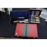 A set of six Victorian style chrome plated fish knives and forks, in fitted case; a cased set of