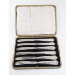 A late 19th Century cased set of silver tea knives, handles hallmarked Sheffield 1929, V.B Vickers &