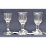 An 18th century facet stem wine glass, the ogee bowl with lens and star cut border to the rim,
